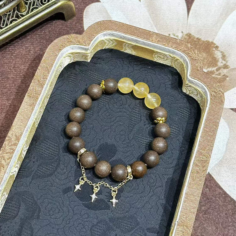 Han Palace Skin Scent R-B49 丨Dark Brown Plant Aroma Wrist Beads with Clear Yellow Crystal & Star Metal Charms