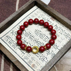 Handcrafted Reconstructed Cinnabar Scented Wrist Strand R-B60 Mild Botanical Aroma with Gilded Rotating Spacer Bead