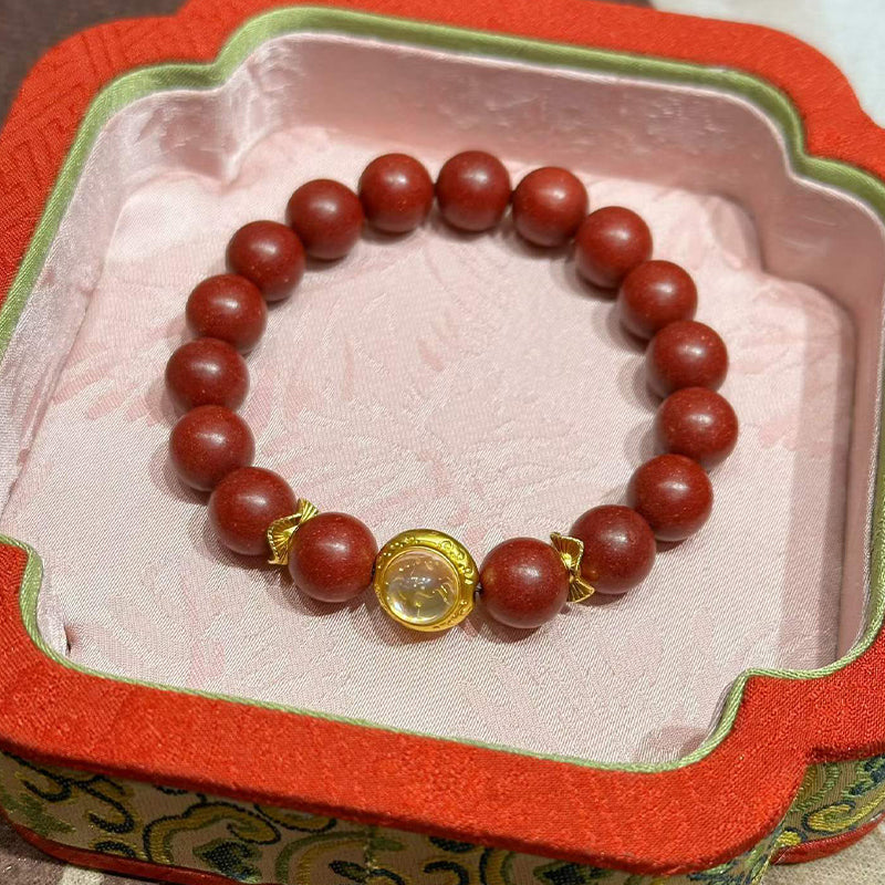 Handcrafted Reconstructed Cinnabar Scented Wrist Strand R-B60 Mild Botanical Aroma with Gilded Rotating Spacer Bead