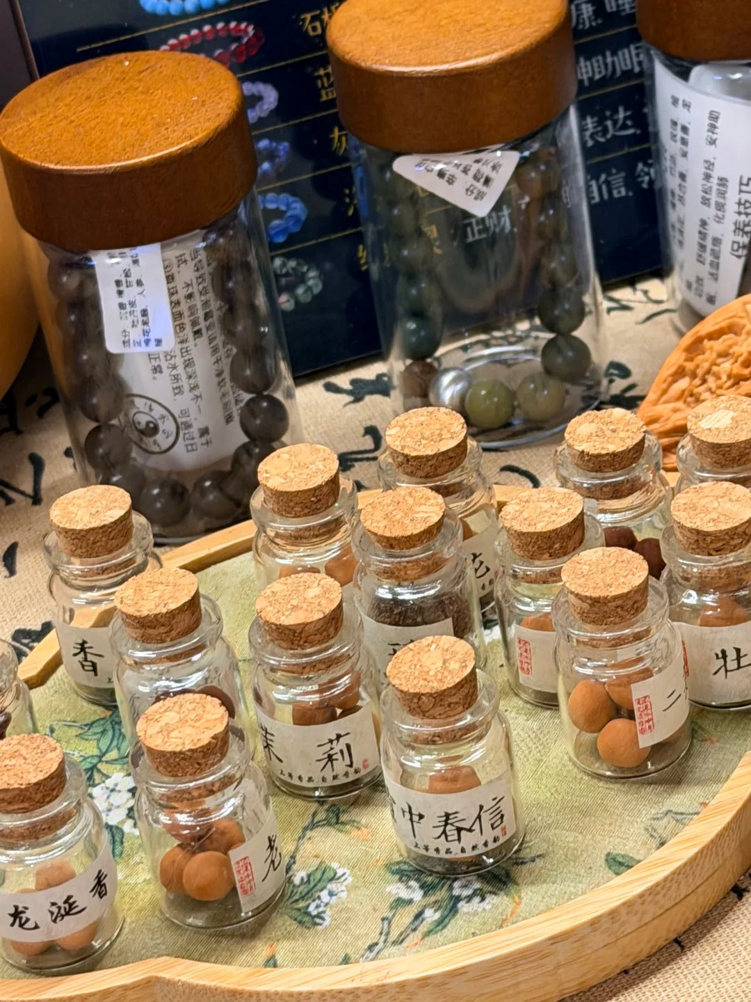 Hand finishing herbal beads before bracelet stringing